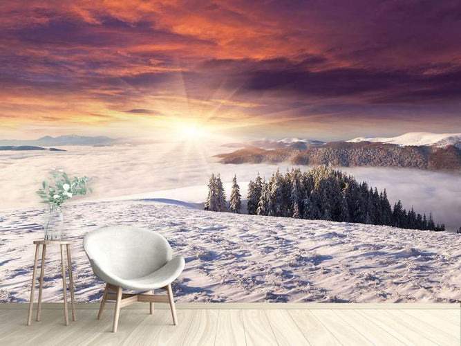 Fotobehang Zonsondergang boven een Winterlandschap