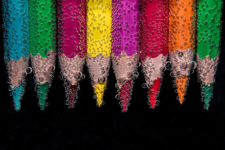 Fotobehang Crayons in the water