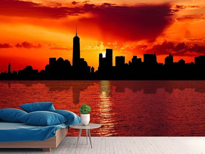 Fotobehang skyline van NYC bij zonsondergang