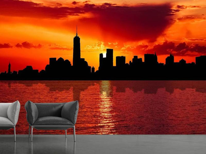 Fotobehang skyline van NYC bij zonsondergang