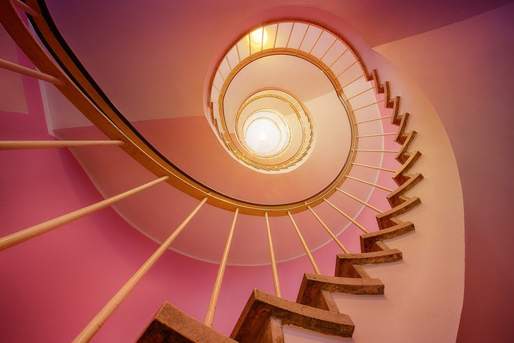 Fotobehang Spiral staircase in pink